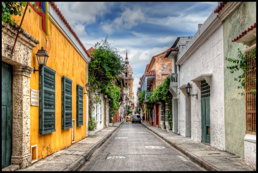 View of a street in Cartagena, Colombia on Sunday morning when there are very few people on the street. ISO 200 , 22mm, f8, (1/1000, 1/250, 1/60) handheld. Tonemapped in Photomatix, poste edited in PS and Nik Color Efex.